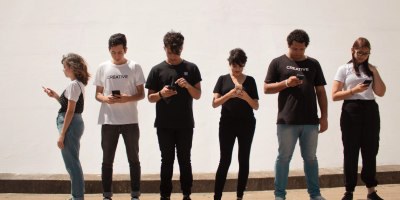 Young people looking at their phones