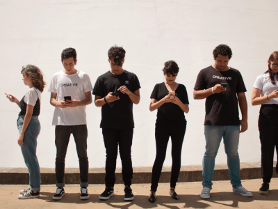 Young people looking at their phones